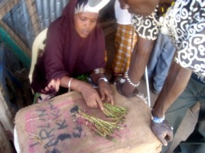 A woman sells miraa in the Somali Market.