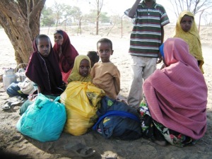 Spontaneous Somali new arrivals wait outside police station